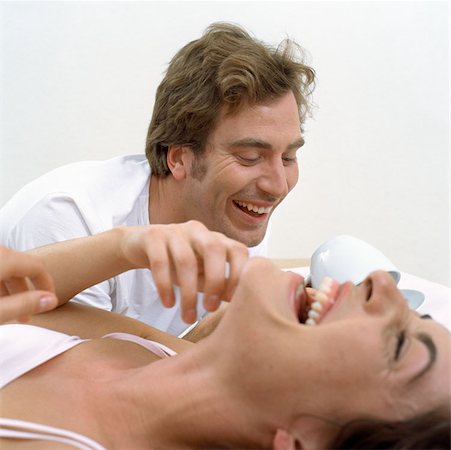 funny intimacy - Happy couple awake in bed Stock Photo - Premium Royalty-Free, Code: 614-00594466