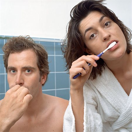 dressed undressed woman pictures - Couple brushing teeth together Stock Photo - Premium Royalty-Free, Code: 614-00594488