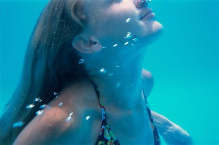 pool mermaid - Girl taking a breather Foto de stock - Sin royalties Premium, Código: 614-00595607
