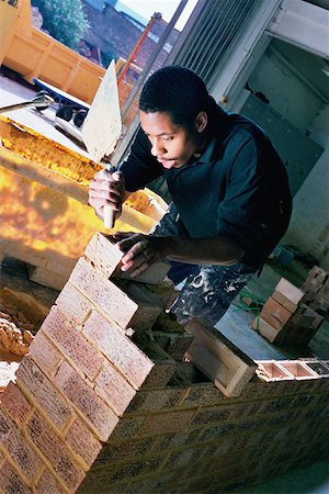 Young bricklayer Foto de stock - Sin royalties Premium, Código: 614-00598818