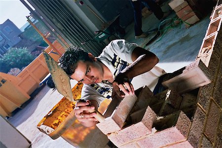 Young bricklayer Foto de stock - Sin royalties Premium, Código: 614-00598820