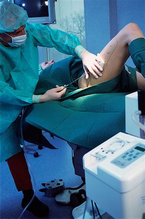 Woman having liposuction Stock Photo - Premium Royalty-Free, Code: 614-00599656