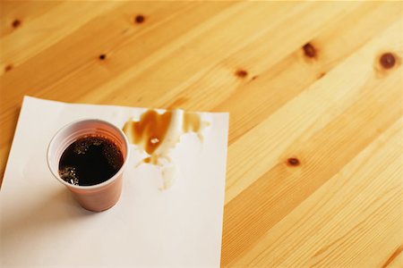 Plastic cup and spilt coffee Stock Photo - Premium Royalty-Free, Code: 614-00602957