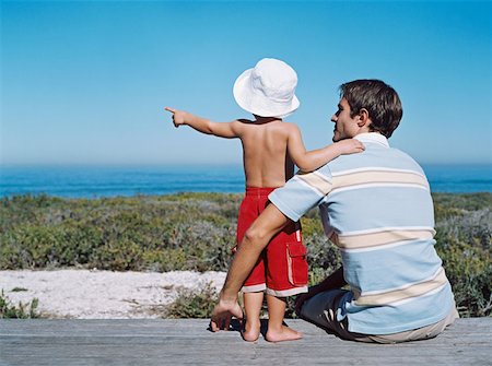 pointing horizon - Father and son looking at the view Stock Photo - Premium Royalty-Free, Code: 614-00654949