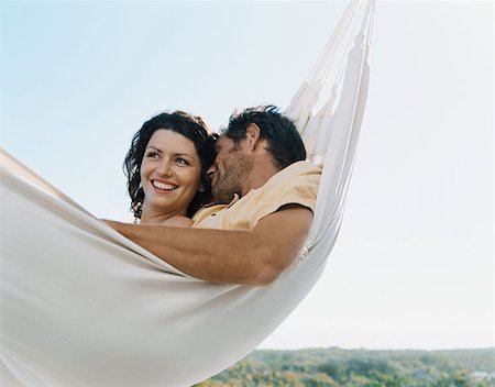 pictures of men sleeping in hammocks - Couple in a hammock Stock Photo - Premium Royalty-Free, Code: 614-00655010