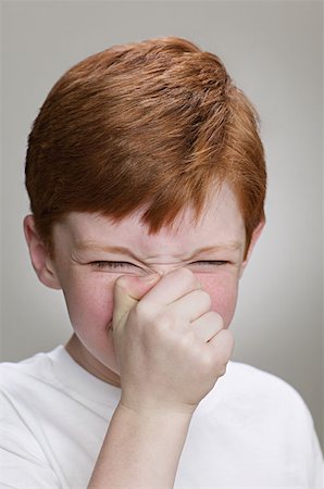 sneezing child - Boy sneezing Stock Photo - Premium Royalty-Free, Code: 614-00655109