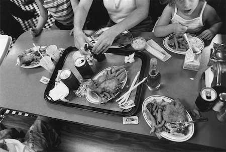 food salt kids - Family having junk food meal Stock Photo - Premium Royalty-Free, Code: 614-00657817