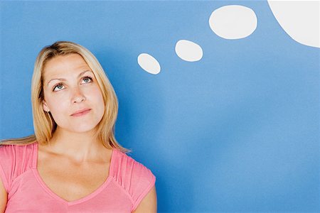 speech bubble with someone thinking - Woman with thought bubble Stock Photo - Premium Royalty-Free, Code: 614-00658120