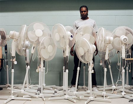 simsearch:614-00651999,k - Man trapped by electric fans Stock Photo - Premium Royalty-Free, Code: 614-00652007