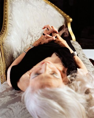 Senior woman sleeping on a chaise longue Stock Photo - Premium Royalty-Free, Code: 614-00653614