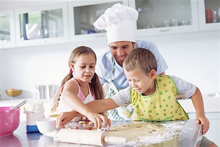 parent child messy cooking - Father and children baking Stock Photo - Premium Royalty-Free, Code: 614-00653921