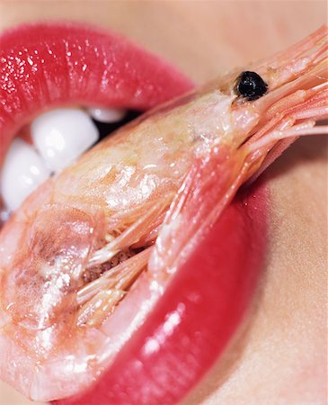 eat mouth closeup - Woman with a prawn in her mouth Stock Photo - Premium Royalty-Free, Code: 614-00684042