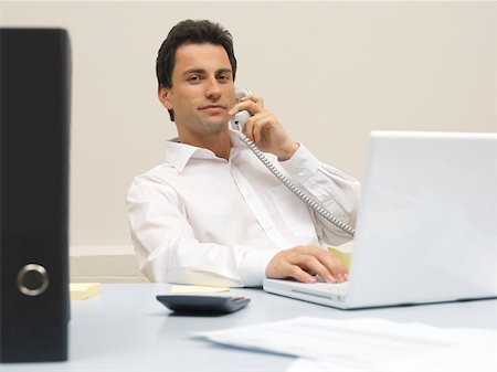 simsearch:614-02680155,k - Office worker on the telephone Stock Photo - Premium Royalty-Free, Code: 614-00694215