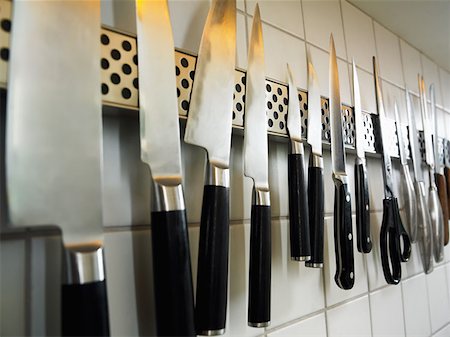 dangerous kitchen - Row of knives and scissors Stock Photo - Premium Royalty-Free, Code: 614-00694761