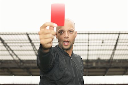 Ref holding red card Stock Photos - Page 1 : Masterfile