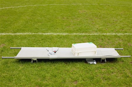 Stretcher and first aid on football pitch Fotografie stock - Premium Royalty-Free, Codice: 614-00808653