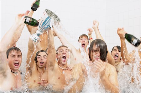 football players winning a trophy - Winning football team in the bath Stock Photo - Premium Royalty-Free, Code: 614-00808664