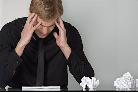 people in panic - Stressed man at his desk Stock Photo - Premium Royalty-Free, Code: 614-00844191