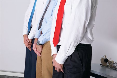 simsearch:614-01561390,k - Businessmen covering their crotches Stock Photo - Premium Royalty-Free, Code: 614-00844351