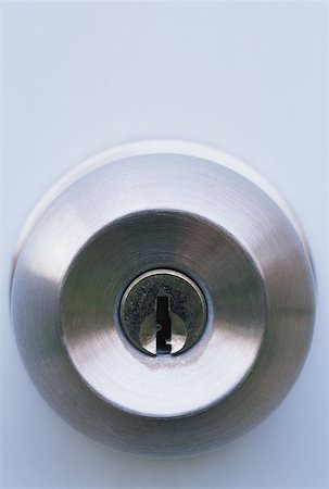 simsearch:614-00808302,k - Lock in a door knob Fotografie stock - Premium Royalty-Free, Codice: 614-00844402