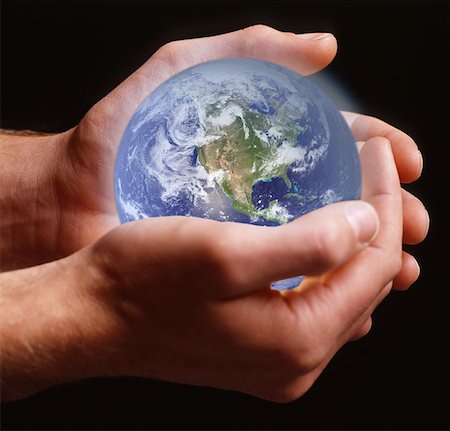 safe world - Person holding planet earth Stock Photo - Premium Royalty-Free, Code: 614-00844429