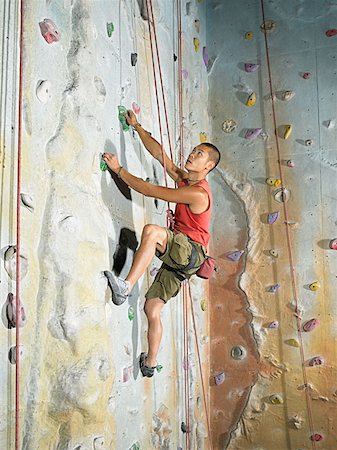 rock climbing indoors full length - Man on climbing wall Stock Photo - Premium Royalty-Free, Code: 614-00892177