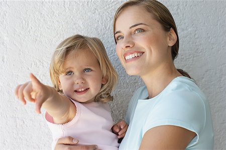 Mother holding her daughter Stock Photo - Premium Royalty-Free, Code: 614-00892582