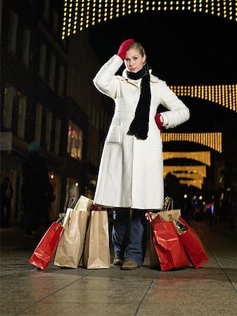 picture of tired woman with shopping bags - Stressed woman christmas shopping Stock Photo - Premium Royalty-Free, Code: 614-00892892