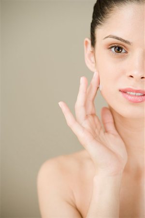 simsearch:614-02242038,k - Young woman applying moisturiser Stock Photo - Premium Royalty-Free, Code: 614-00893177