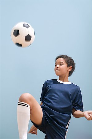 simsearch:614-00893424,k - Boy playing keepy uppy with football Stock Photo - Premium Royalty-Free, Code: 614-00893448