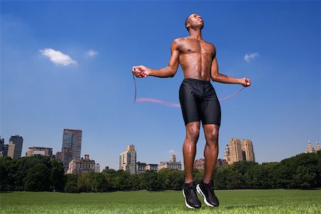 people exercising images skipping - Man skipping in central park Stock Photo - Premium Royalty-Free, Code: 614-00914697