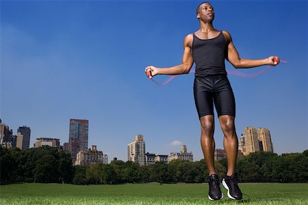 people exercising images skipping - Man skipping in central park Stock Photo - Premium Royalty-Free, Code: 614-00914773