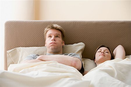 simsearch:6109-06002874,k - Frustrated man and sleeping woman Stock Photo - Premium Royalty-Free, Code: 614-00913784