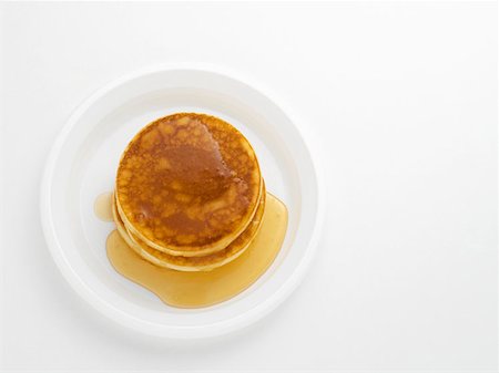 Pancakes with maple syrup Stock Photo - Premium Royalty-Free, Code: 614-00944760