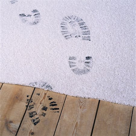 footstep in dirt - Black footprints on a carpet Stock Photo - Premium Royalty-Free, Code: 614-01026363