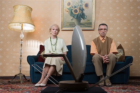 Senior couple watching television Stock Photo - Premium Royalty-Free, Code: 614-01028091