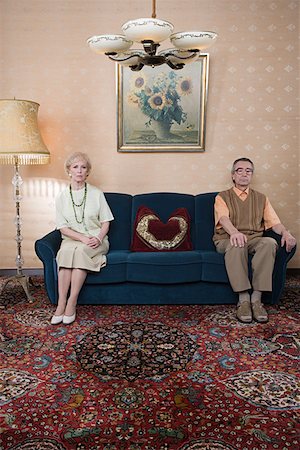 Senior couple on sofa Stock Photo - Premium Royalty-Free, Code: 614-01028132