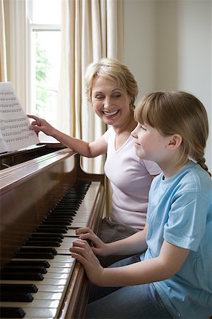 senior woman piano - Girl and grandmother playing piano Stock Photo - Premium Royalty-Free, Code: 614-01028974