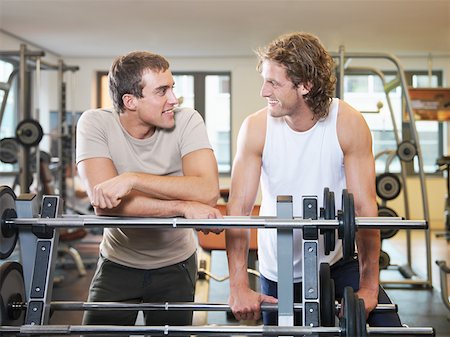 Two men standing at exercising equipment Stock Photo - Premium Royalty-Free, Code: 614-01069202