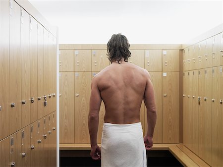 dressing room sports - Man standing in locker room in gym Stock Photo - Premium Royalty-Free, Code: 614-01069227