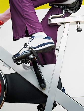 simsearch:614-00602818,k - Woman on exercise bike in health club Stock Photo - Premium Royalty-Free, Code: 614-01069265