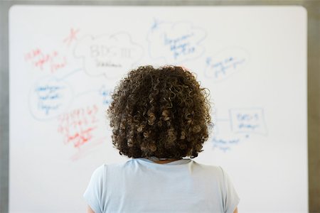 simsearch:614-07652551,k - Woman looking at whiteboard Stock Photo - Premium Royalty-Free, Code: 614-01069774