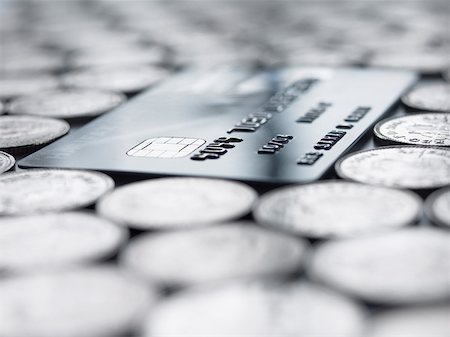 piles of cash pounds - Credit card amongst coins Stock Photo - Premium Royalty-Free, Code: 614-01087146