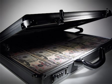 Briefcase full of fifty dollar notes Stock Photo - Premium Royalty-Free, Code: 614-01087177