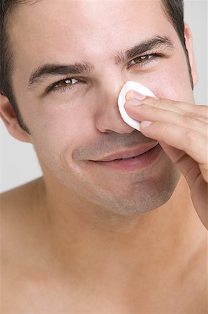 face and cleanse and one person - Man cleaning his face Stock Photo - Premium Royalty-Free, Code: 614-01088168