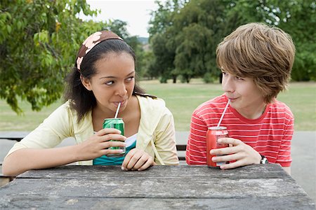 drinking can - Teenage couple drinking fizzy drinks Stock Photo - Premium Royalty-Free, Code: 614-01118085