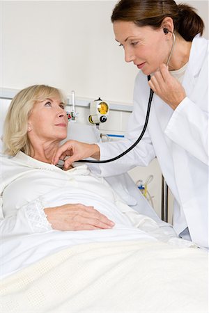 simsearch:614-02984090,k - Patient and doctor with stethoscope Stock Photo - Premium Royalty-Free, Code: 614-01179293