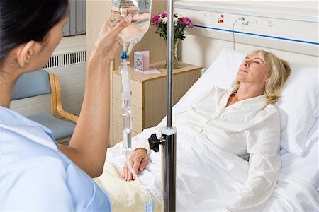 Nurse and sleeping patient Stock Photo - Premium Royalty-Free, Code: 614-01179346