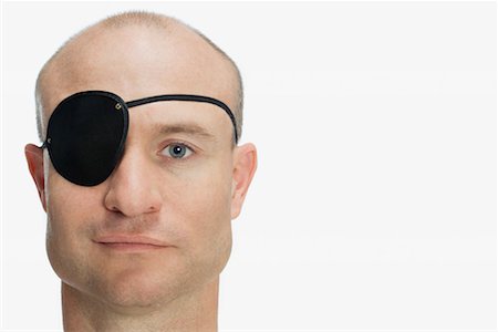 Man wearing eye patch Stock Photo - Premium Royalty-Free, Code: 614-01179868