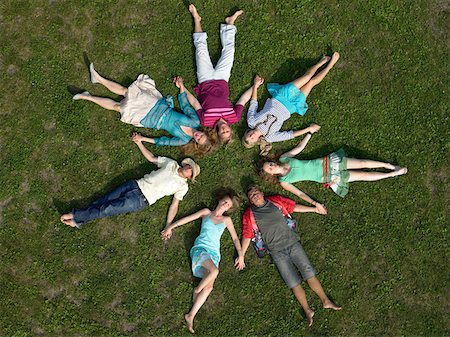 people lying in circle - Friends sleeping holding hands Stock Photo - Premium Royalty-Free, Code: 614-01171679